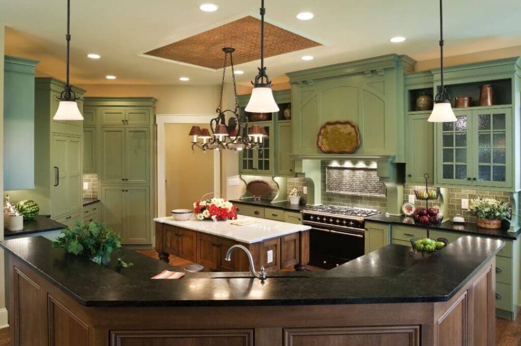 A kitchen in Littleton, CO featuring green cabinets and sleek black countertops. 