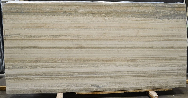 A large marble slab resting on a pallet in Littleton, CO, showcasing its natural beauty and texture. 